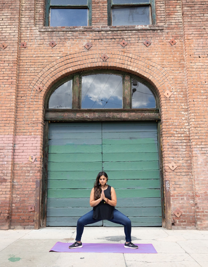 yoga-in-front-of-bricks-building